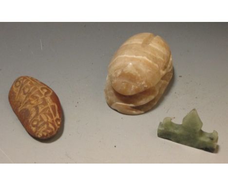 A jade brush rest, agate scarab and a rune carved stone  