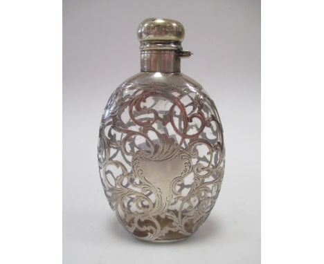 A silver mounted glass hip flask together with an electroplate tastevin  