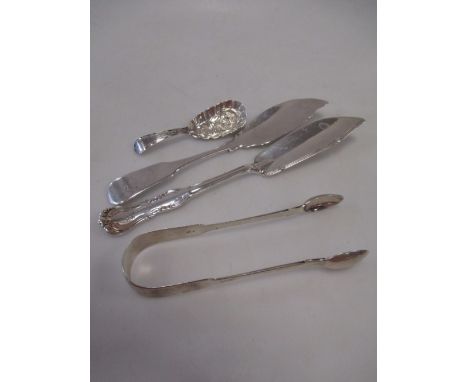 Two silver butter knives, a caddy spoon and a pair of sugar tongs  
