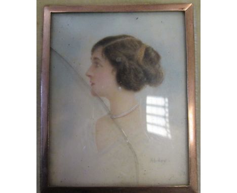 An early 20th century portrait miniature of a lady with brown hair, white dress and wearing pearl earrings and necklace, pain