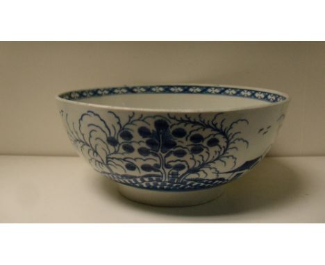 A first period Worcester blue and white bowl, 23cm (9 in) diameter  Some wear to the interior glaze otherwise good