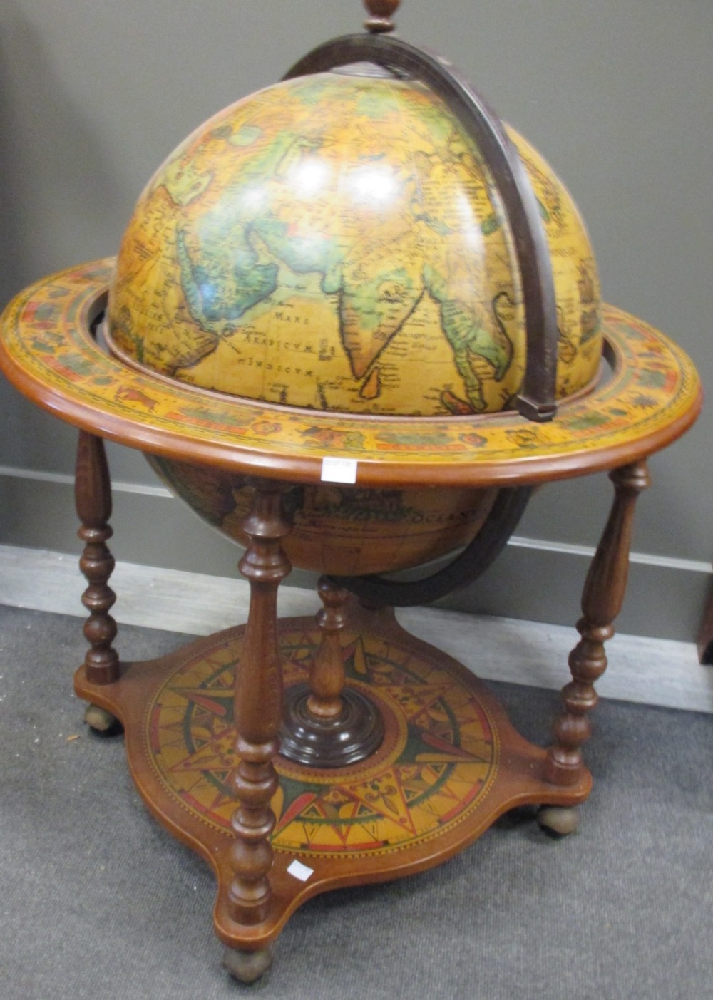 A Terrestrial globe drinks cabinet