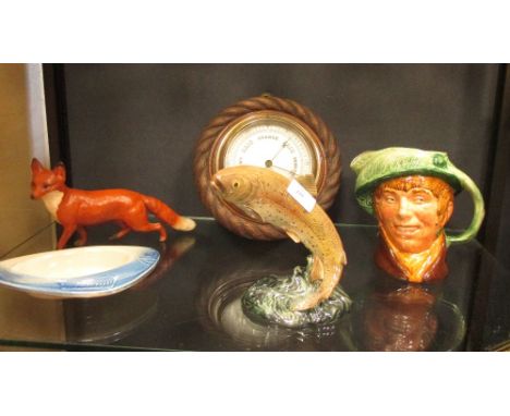 A Beswick pottery brown trout, No.1032 and a figure of a fox, aRoyal doulton 'Arriet' 1946 character jug and a barometer  