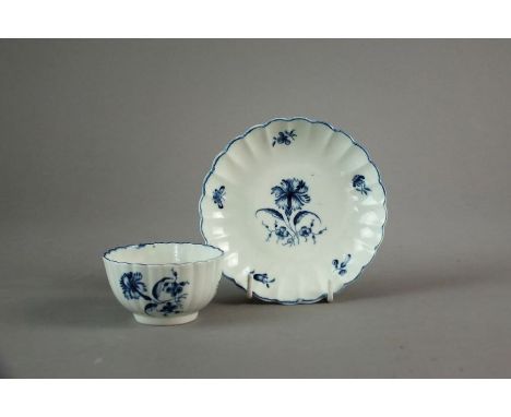 A Worcester porcelain tea bowl and saucer, circa 1770-85, decorated in the Gillyflower pattern, crescent mark in underglaze b