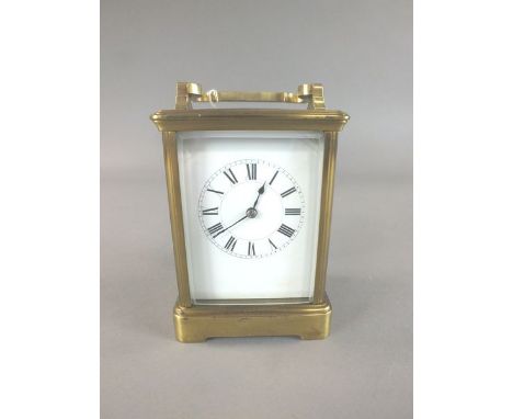 An Edwardian brass cased carriage clock The typical movement with platform escapement and striking the hour and half hour on 