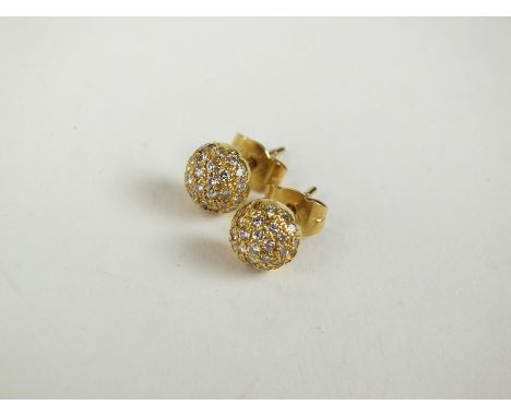 A pair of 18ct gold diamond earrings, each designed as a some of pave set brilliant cut diamonds, with post and butterfly fit