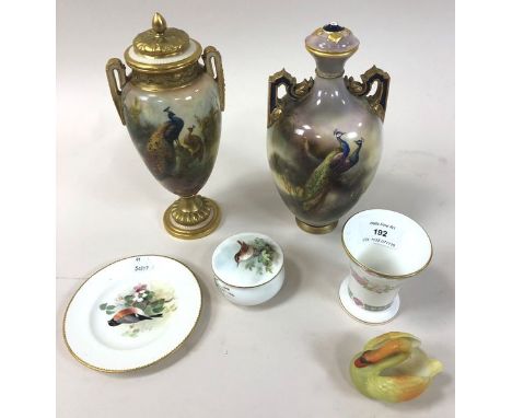 A Royal Worcester Hadley Ware vase and cover painted with peacocks (restored), 23.5cm high, a small Royal Worcester plate pai