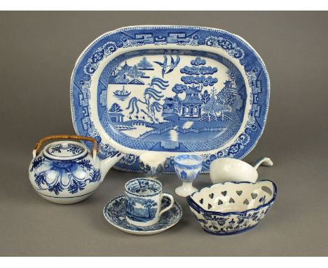 A collection of 19th/20th century blue and white English eartherware, comprising Willow pattern meat platters, egg cups, thre