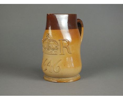 A large Doulton Lambeth salt glazed stoneware three pint jack, in brown and buff, stitched leather effect detailing, incised 