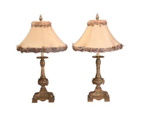 A pair of Neo-Classical style gilt composition table lamps, 20th century, with beaded columns and rectangular leaf-capped bas