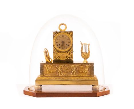A French Empire gilt brass 8-day mantle clock, early/mid 19th century, the body of architectural form with applied musical tr
