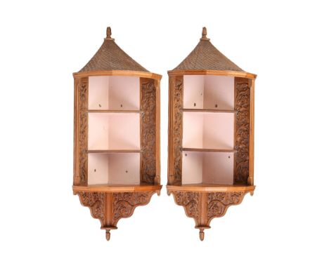 A pair of Victorian architectural bow-fronted oak open corner shelves, each with a high carved faux "bull nose" pan tile cano