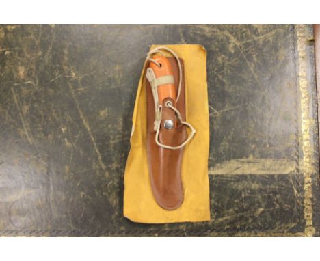 WW2 British RAF Dingy Survival knife, Complete in scabbard mounted on a section of dingy canvas material. Blade marked with S