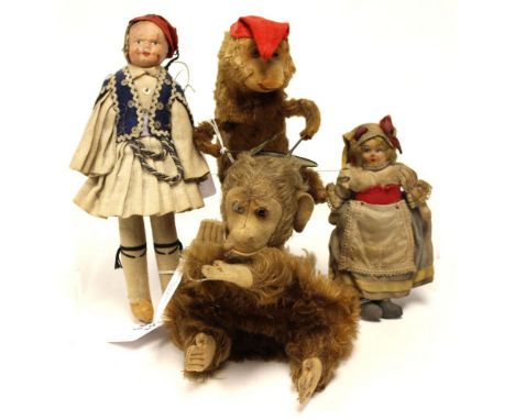 Juvenalia: A collection of items to comprise: a wind-up cymbal monkey, a papier mache doll and another, and a monkey puppet. 