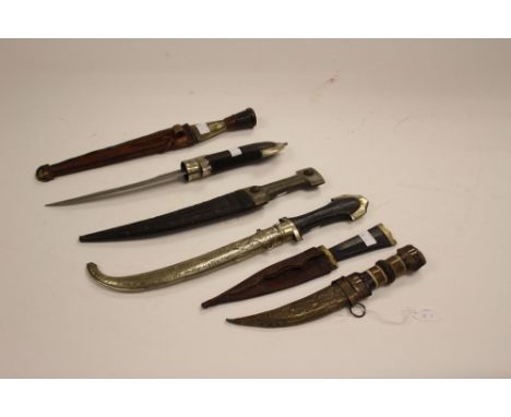 A collection of six Caucasian and Middle Eastern daggers. One  without scabbard. (6)