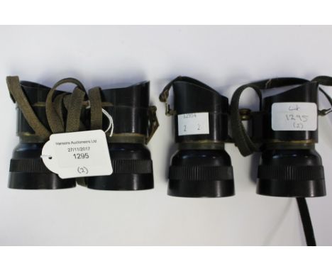 WW2 British Binoculars: two pairs of Broad Arrow marked binoculars, Both have slings.