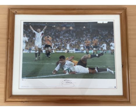 Rugby Jason Robinson Signed Big Blue Tube Print. 39 of 1000. Housed in Wooden Frame Measuring 27x21 inches overall. Print sho