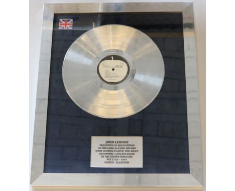 JOHN LENNON - a modern replica 'platinum' award which reads 'John Lennon presented in recognition of the long playing record 