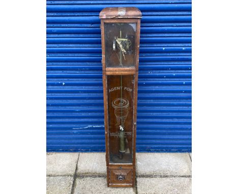 An oak cased wall clock, with decorative etched glass panel bearing Michelin advertising.
