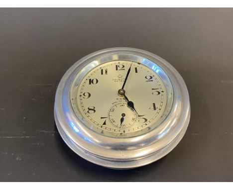A Coventry Astral aluminium cased eight day car clock. 