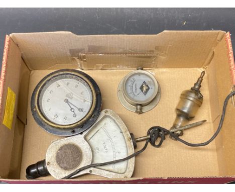 A Smiths eight day car clock, a voltmeter, an oil sight etc.
