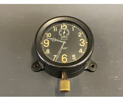 A Zenith bakelite cased eight day car clock, bottom wind. 