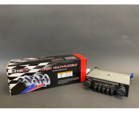 A cased turbo multi-flexible pipe plus a British Leyland circa 1980 radio, by repute working. 