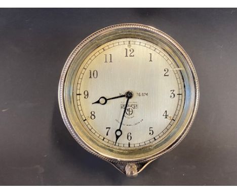 A Smiths rim-wind eight day car clock, appears restored. 