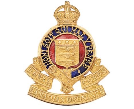 Royal Canadian Ordnance Corps Officers cap badge circa 1948-52.Fine die-stamped gilt crowned pierced Garter on blue enamel re