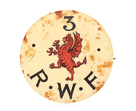 3rd Royal Welsh Fusiliers WW1 celluloid badge.Very scarce early WW1 circular example worn prior to issue of usual badge. Whit