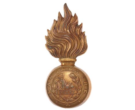Lancashire Fusiliers post 1881 fur cap grenade.Good die-stamped brass flaming grenade, the ball bearing LANCASHIRE circlet en