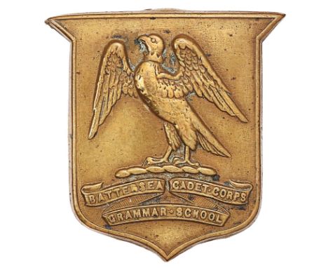Battersea Grammar School Cadet Corps cap badge.Good scarce die-stamped brass shield bearing hawk on tri-part title scroll.  L