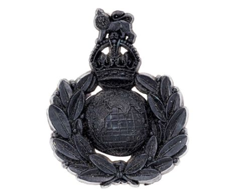 Royal Marines WW2 dark blue plastic economy cap badge.Good scarce Globe surmounted by Royal Crest resting in laurel sprays.A.