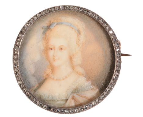 EARLY 20TH CENTURY SCHOOL, A MINIATURE PORTRAIT OF MARIE ANTOINETTE indistinctly signed, in gold coloured metal brooch mount,