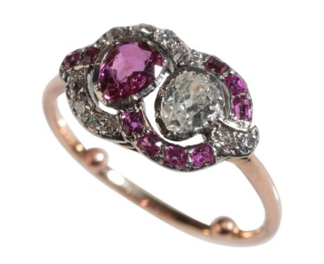 AN EDWARDIAN RUBY AND DIAMOND RING to an unmarked yellow metal shank, with arthritic balls, ring size L, (c.3grams)