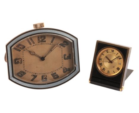 A JAEGER-LECOULTRE TRAVEL CLOCK with manual wind movement, the gold dial with black Roman numerals, black hands and date aper