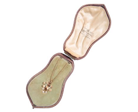 AN EDWARDIAN PEARL AND ENAMEL PENDANT the pendant of naturalistic form, designed with two three leafed clovers enamelled and 