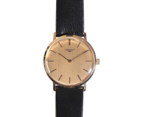 LONGINES: A GENTLEMAN'S GOLD-PLATED WRISTWATCH with manual wind movement, the gold dial with baton numerals and dark blue ste