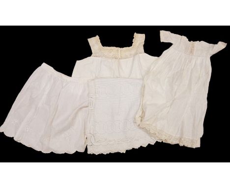 A box of white wear containing: a maid's apron/overall dating from Edwardian era up to the 1930s; a ladies silk combination; 