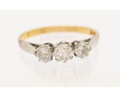 A three stone diamond and 18ct gold ring, comprising three graduated round brilliant cut diamonds, total diamond weight appro