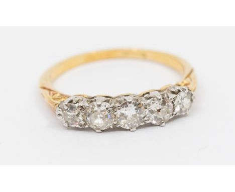 A diamond and 18ct gold five stone ring, comprising five claw set graduated old cut diamonds, the principal diamond approx 0.