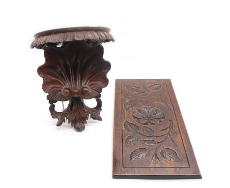 A carved 19th Century oak wall hanging panel, along with mahogany wall hanging bracket/shelf with foliage and shell detail