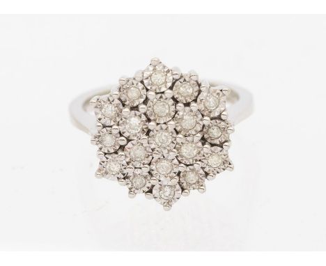 A diamond set 9ct white gold cluster ring, comprising a circular setting, set with small illusion set diamonds, setting appro