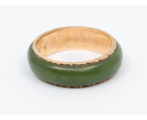 A 10ct gold and and jade set ring, width approx 6mm, size O1/2, total gross weight approx 3.1gms   Further details: good ston