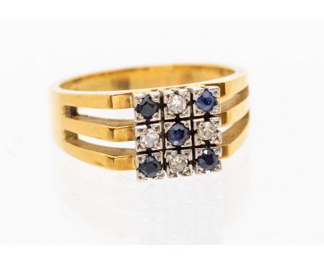 A sapphire and diamond set 18ct gold ring, comprising a white gold square top grain set with alternate round cut sapphires an