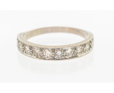 A diamond 9ct white gold half eternity ring, comprising a row of ten grain set round eight cut diamonds, total diamond weight