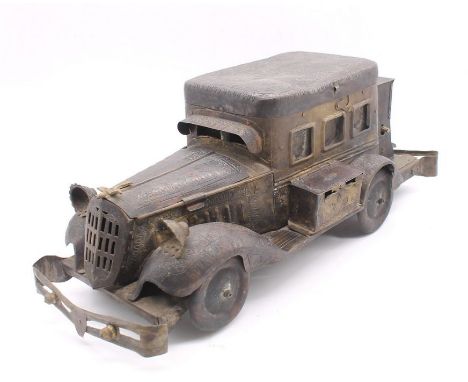 An early 20th century Saudi Arabian novelty cigarette box in the form of a vintage car