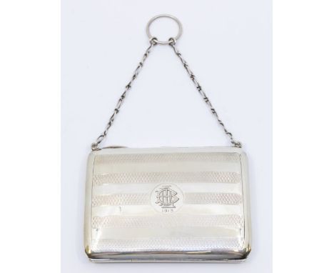 A George V silver aide memoire, engine turned stripped decoration with central monogram and dated 1913, fitted interior, on s