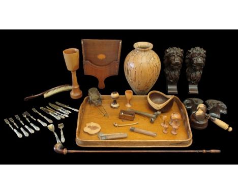 A mixed collection of wooden items to include; a pair of Lion headed hangings, large modern turned wooden vase, tray, two Afr