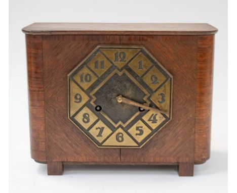 An Art Deco designed mantel clock with brass dial and face, on four square feet, brass movement. Keys to back. (untested)